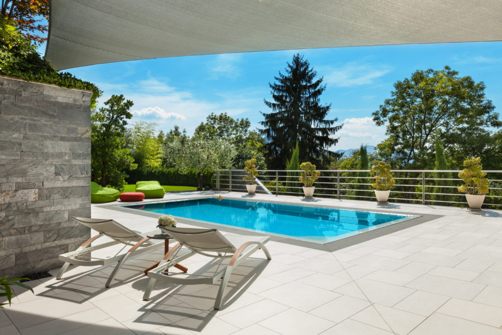 beautiful house, swimming pool view from the veranda, summer day